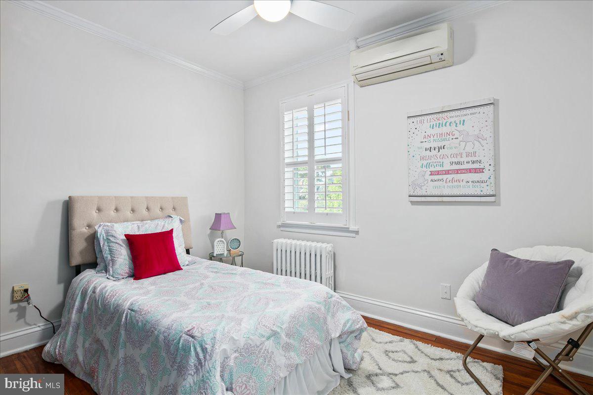 6411 7th Street Northwest Washington, DC 20012 - Photo 18 of 35 a bedroom with a bed and wooden floor