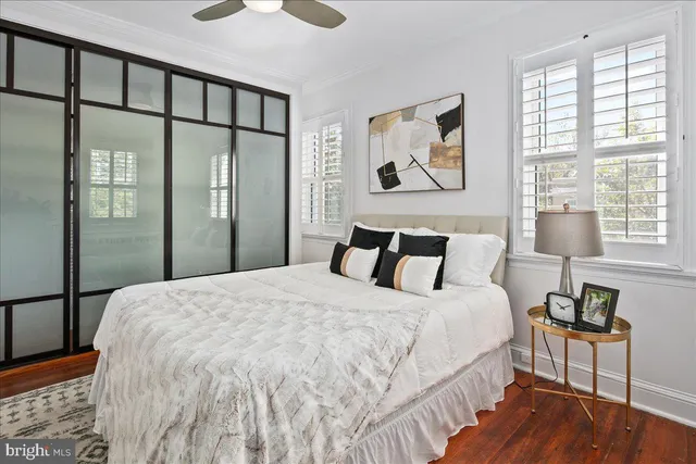 a bedroom with a large bed and a window