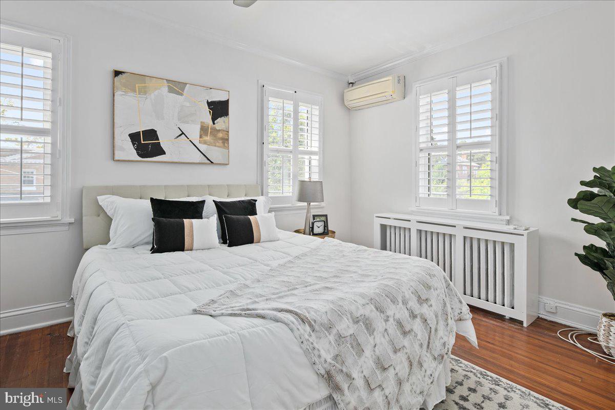 6411 7th Street Northwest Washington, DC 20012 - Photo 22 of 35 a bedroom with bed and wooden floor