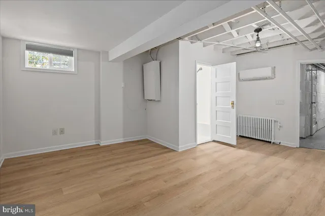 a view of a big room with wooden floor and closet
