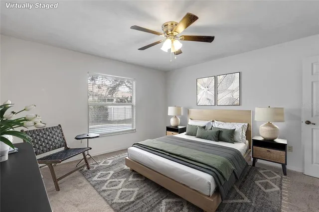 a bedroom with a bed and a chair