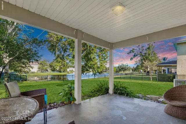 a view of a patio with a yard