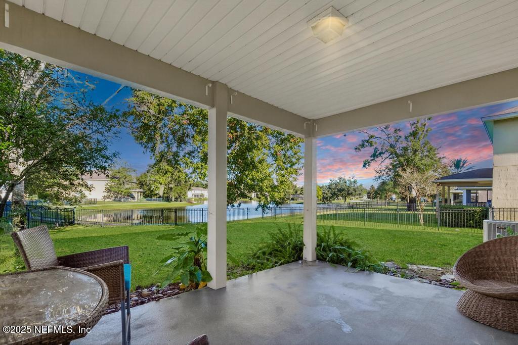 a view of a patio with a yard