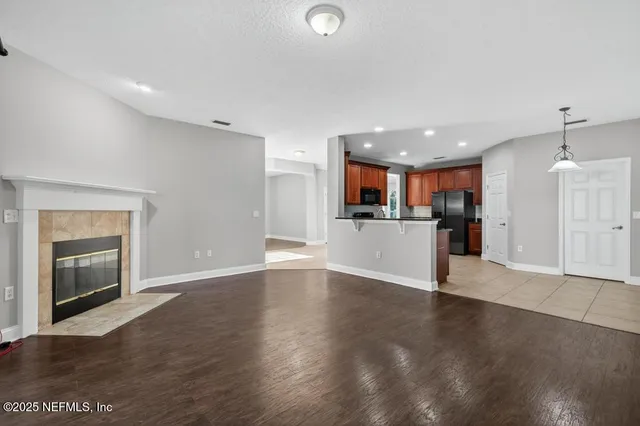 a view of kitchen with a sink and a stove top oven