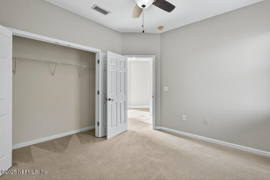 612 Spruce Creek Road St. Johns, FL 32259 - Photo 20 of 50 wooden floor in an empty room