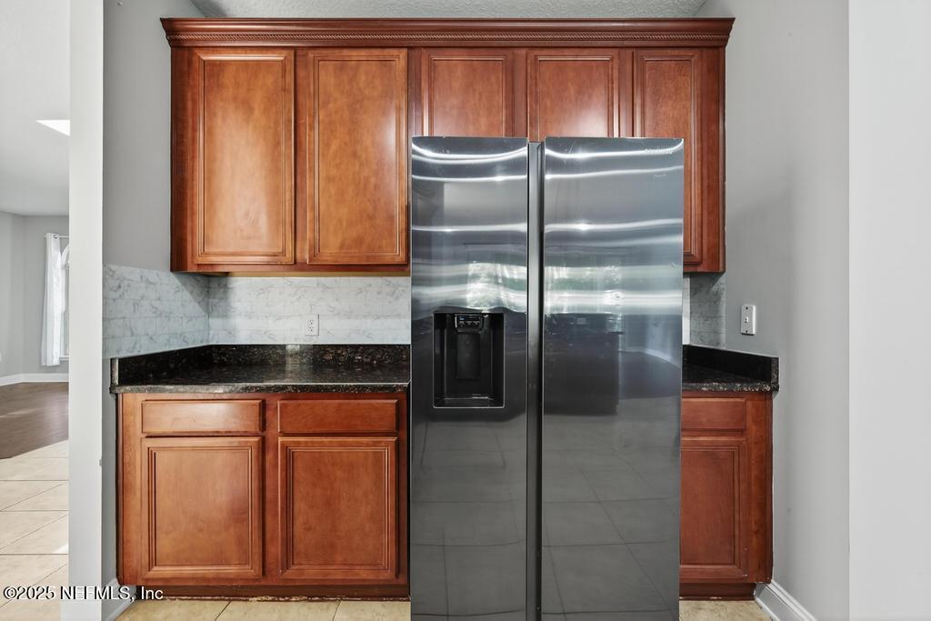 612 Spruce Creek Road St. Johns, FL 32259 - Photo 21 of 50 a close view of a refrigerator in kitchen and a refrigerator
