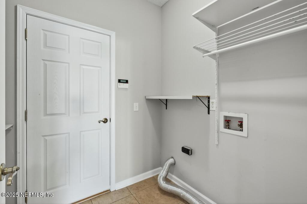 612 Spruce Creek Road St. Johns, FL 32259 - Photo 27 of 50 a bathroom with a window