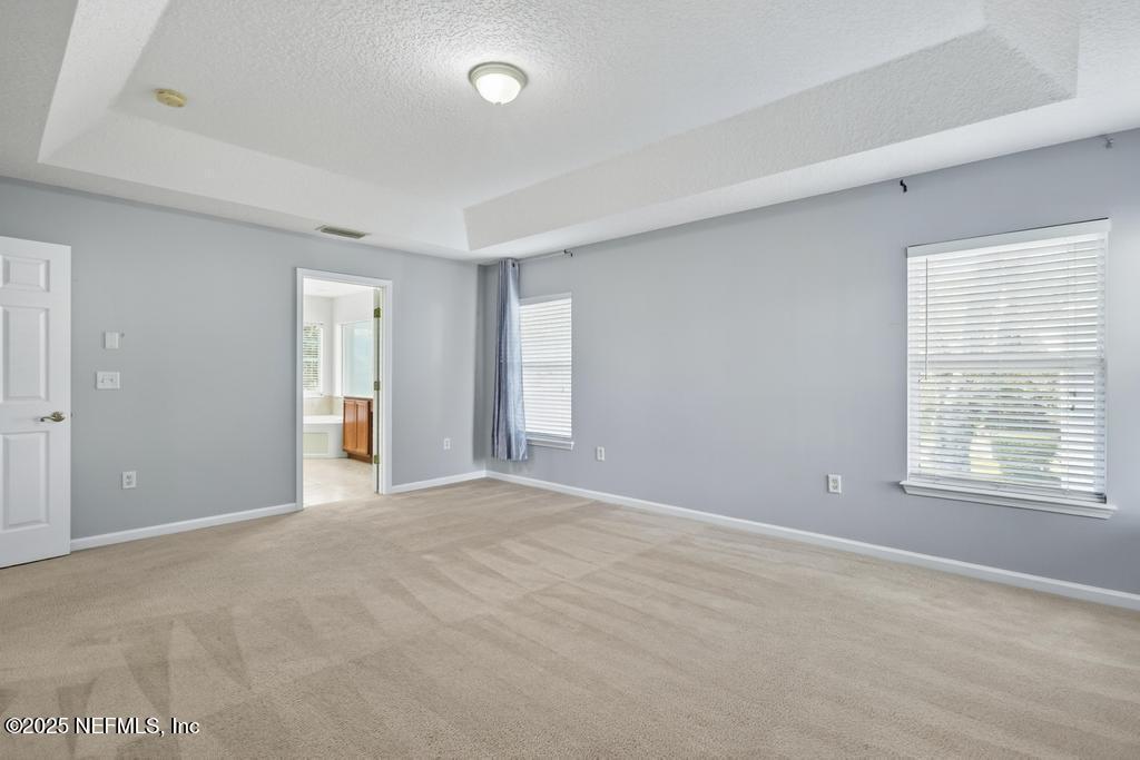 612 Spruce Creek Road St. Johns, FL 32259 - Photo 34 of 50 a view of an empty room with a window