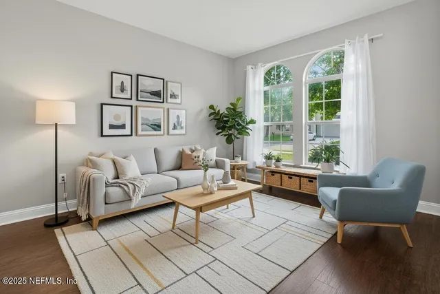 a living room with furniture and a window