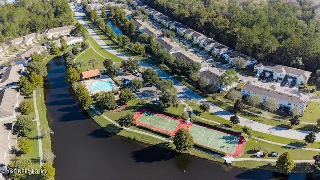 an aerial view of residential houses with outdoor space