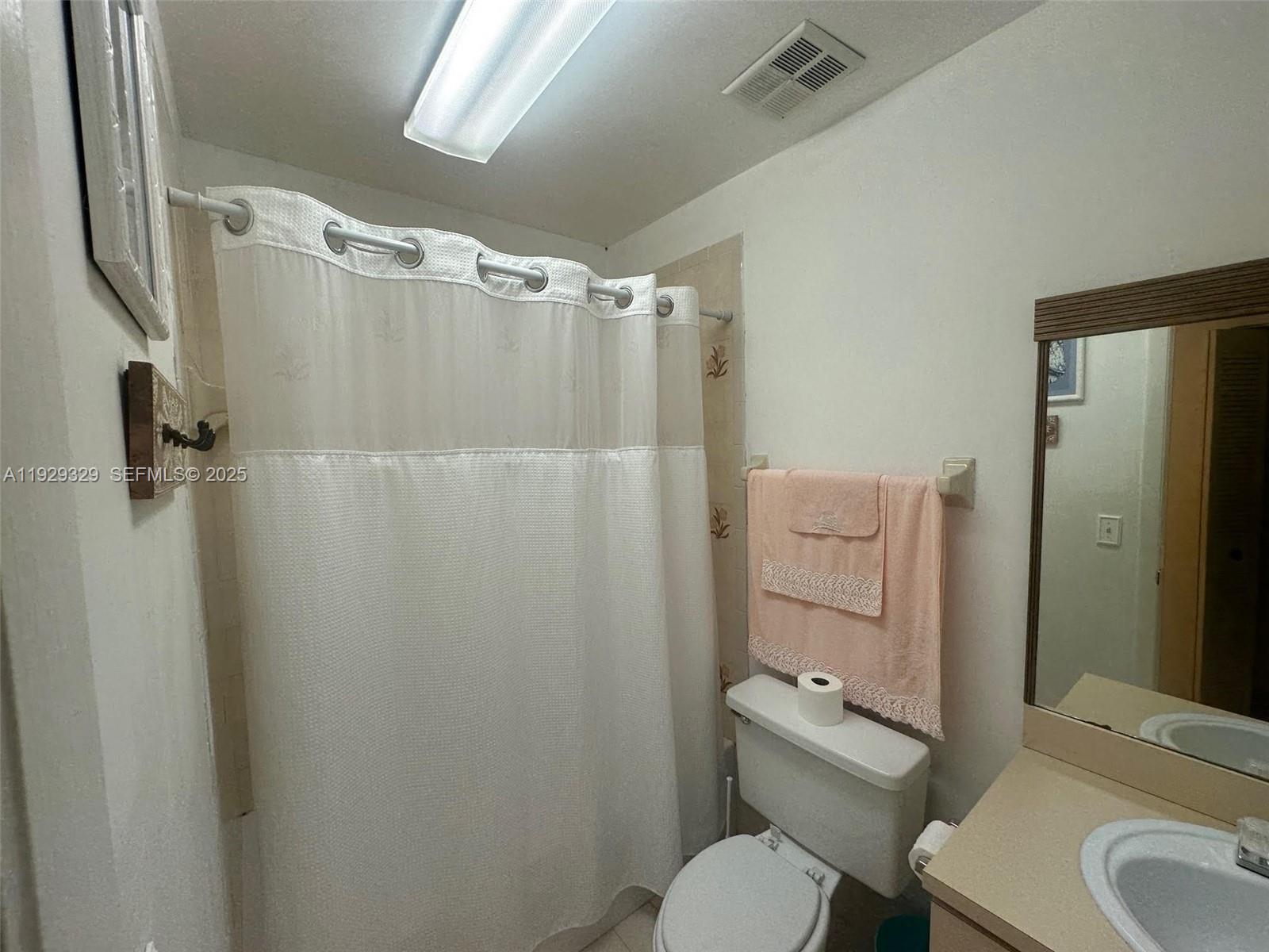 8326 Southwest 10th Terrace Miami, FL 33144 - Photo 7 of 10 a bathroom with a sink toilet and shower