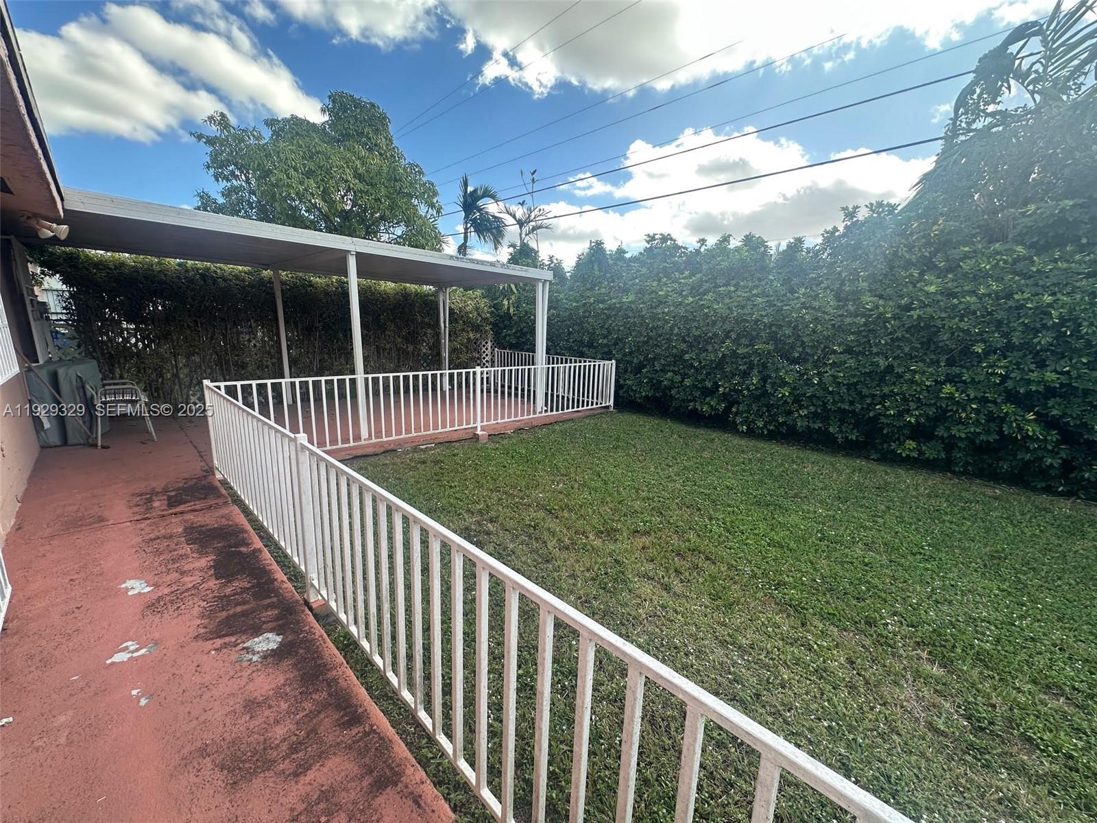 8326 Southwest 10th Terrace Miami, FL 33144 - Photo 10 of 10 a view of a deck with a backyard