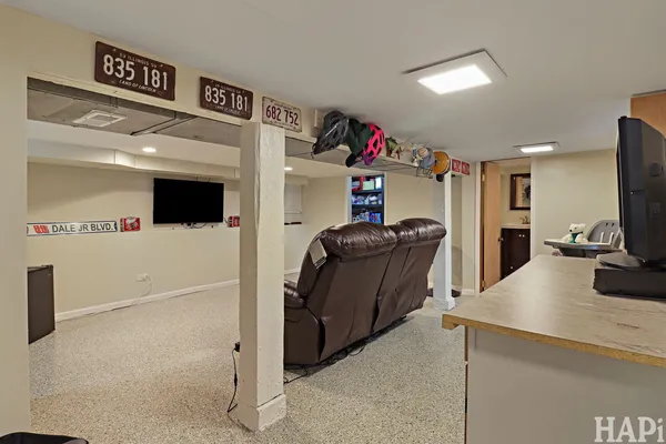 a kitchen with refrigerator and cabinets