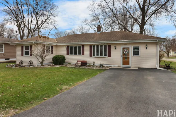 a front view of house with yard and green space