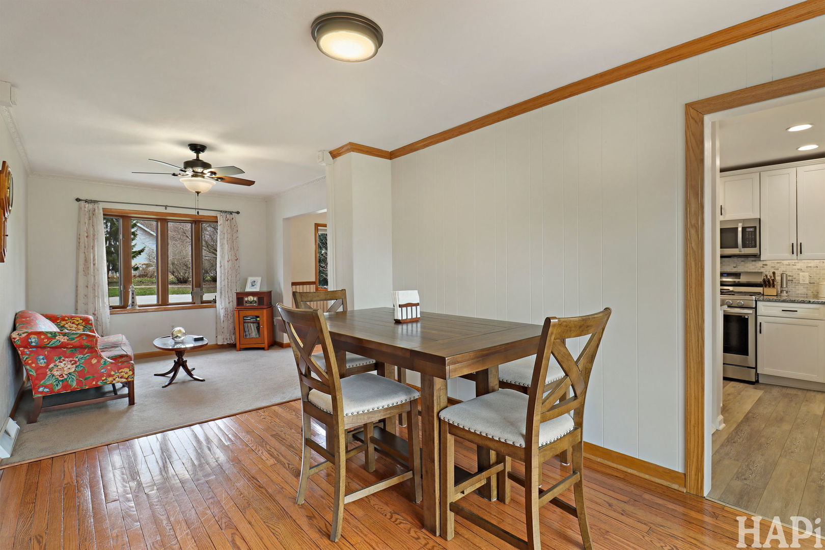 804 Elm Street Maple Park, IL 60151 - Photo 7 of 31 a view of a dining room with furniture and wooden floor
