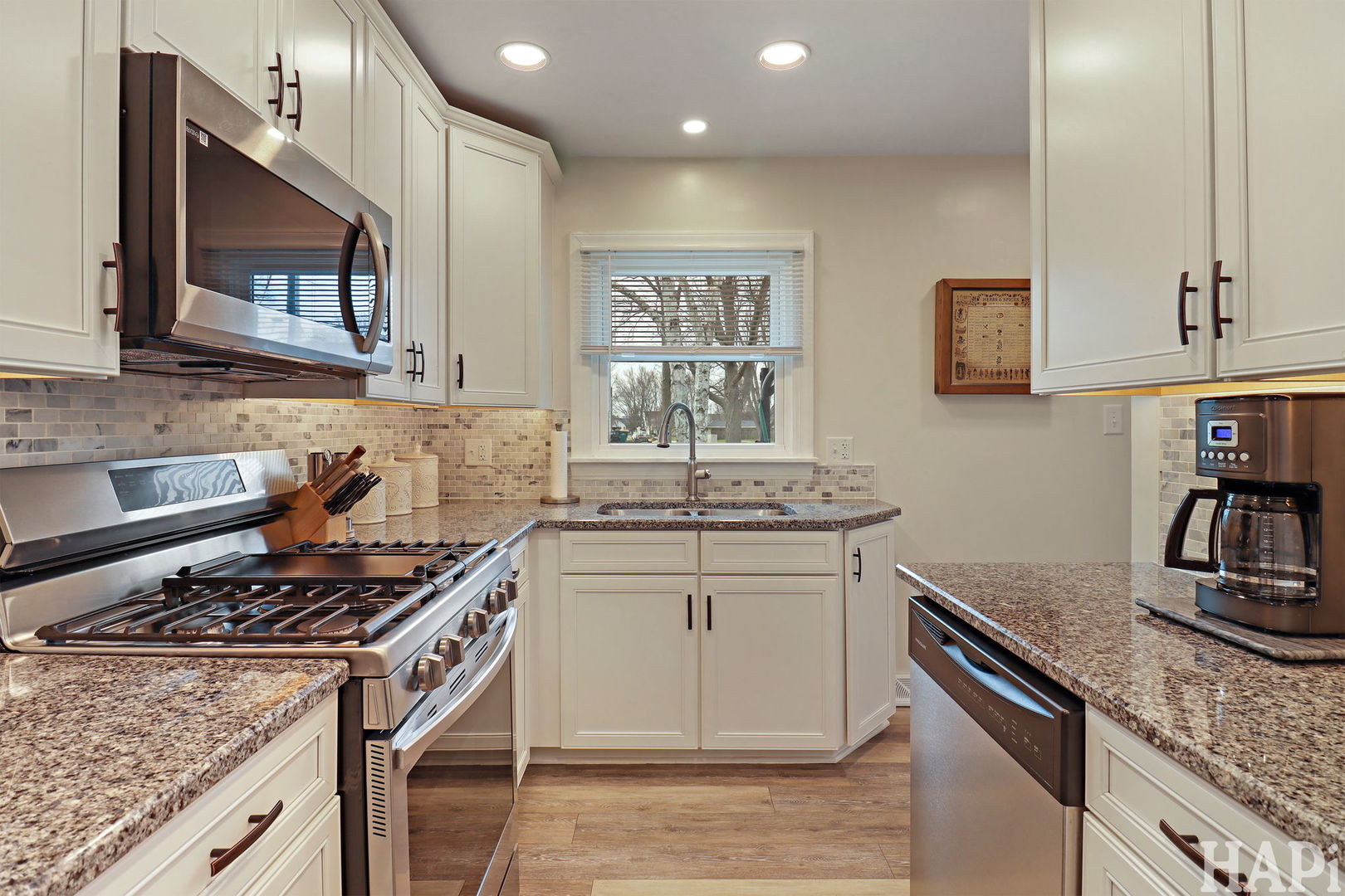 804 Elm Street Maple Park, IL 60151 - Photo 10 of 31 a kitchen with stainless steel appliances granite countertop a stove a sink and a microwave