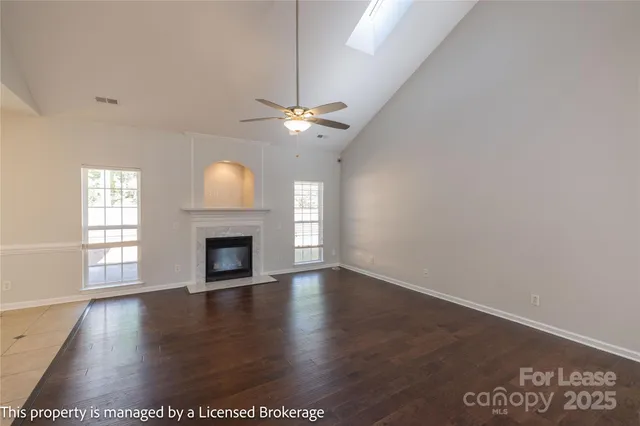 a kitchen with stainless steel appliances granite countertop a sink and a stove
