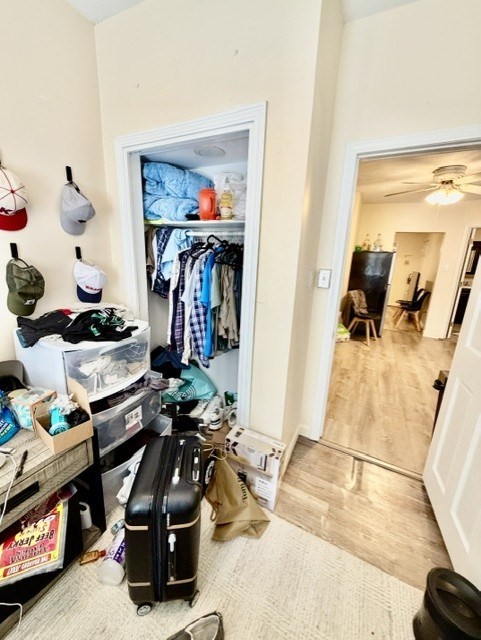 14 Cleveland Place, Unit 2 Boston, MA 02113 - Photo 11 of 18 a room with lots of stuff and wood floor