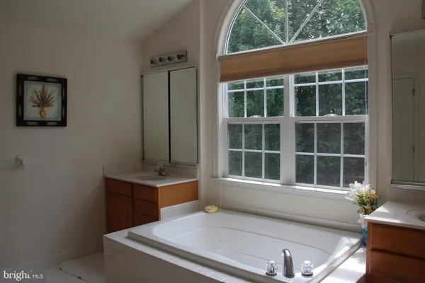 a living room with a large window and table