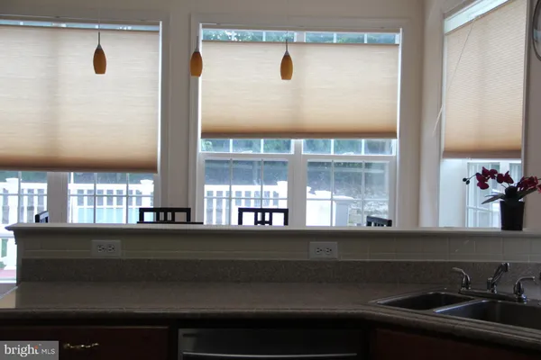 a kitchen with a sink and a window