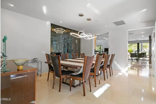 a kitchen with stainless steel appliances granite countertop sink stove and refrigerator