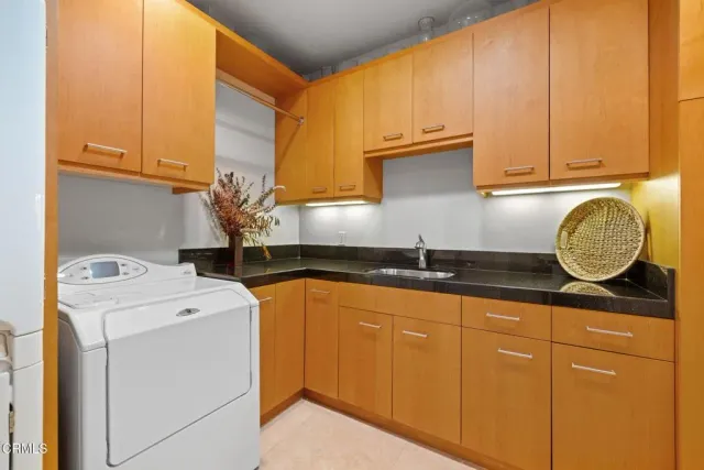 a spacious bathroom with a granite countertop sink a toilet and a shower