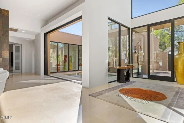 a view of a patio with swimming pool table and chairs