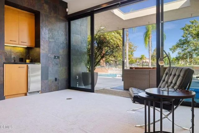 a bed room with a bed and a large window