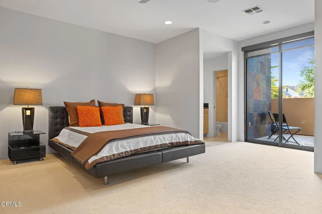 2406 Windermere Street Bakersfield, CA 93311 - Photo 45 of 75 a spacious bedroom with a bed and lamp