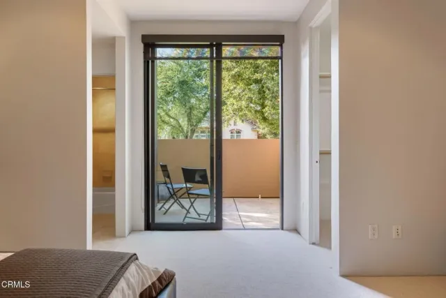 a front view of a house with swimming pool having outdoor seating