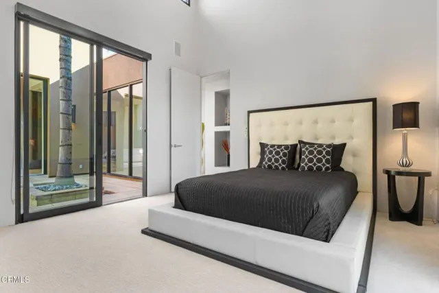 an aerial view of residential houses with outdoor space and swimming pool