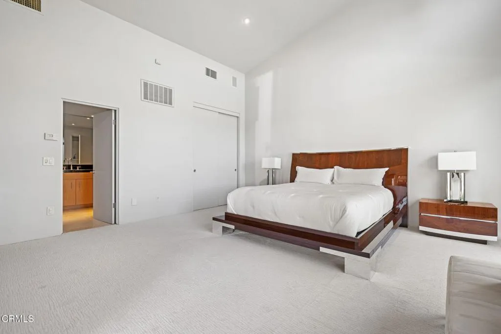 2406 Windermere Street Bakersfield, CA 93311 - Photo 59 of 75 a bedroom with a bed and a lamp