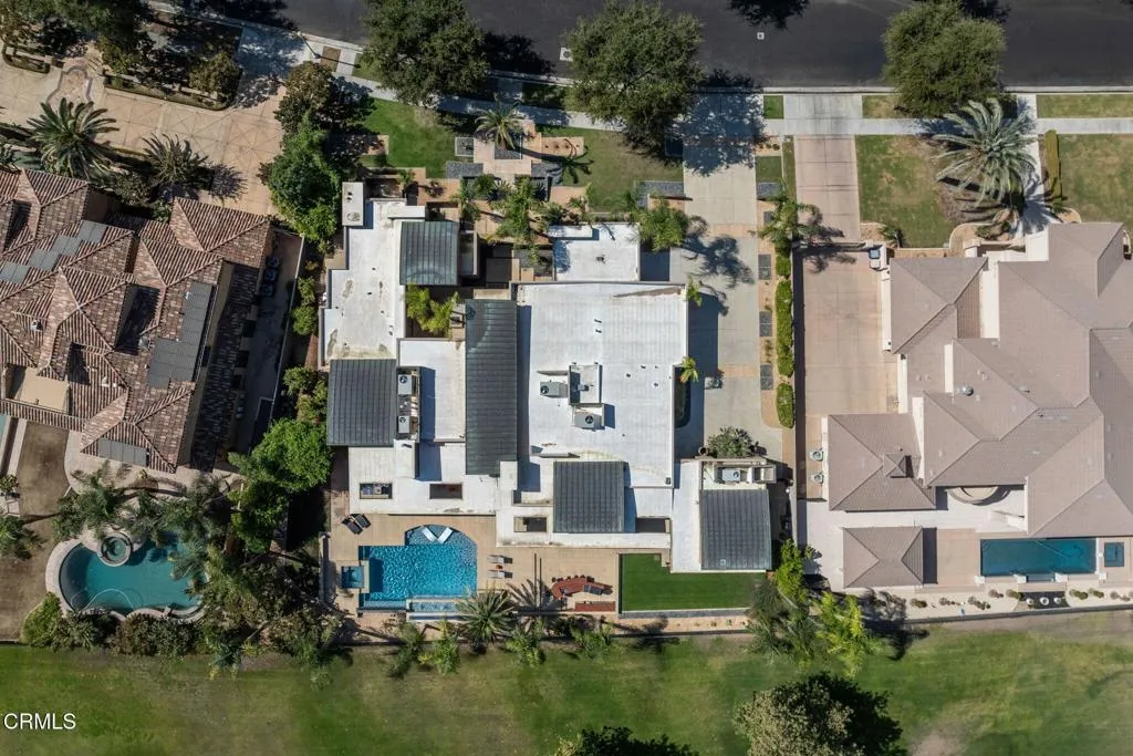 2406 Windermere Street Bakersfield, CA 93311 - Photo 74 of 75 an aerial view of residential houses with outdoor space and swimming pool