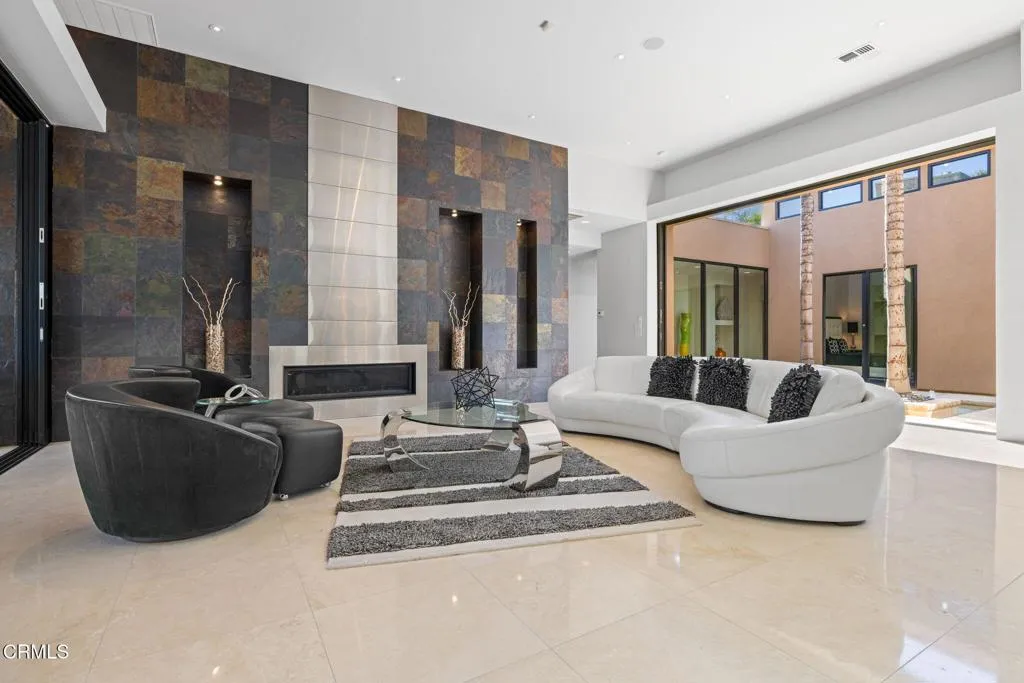 2406 Windermere Street Bakersfield, CA 93311 - Photo 8 of 75 a living room with furniture and a large window