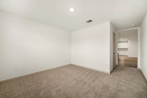 an empty room with a bathroom