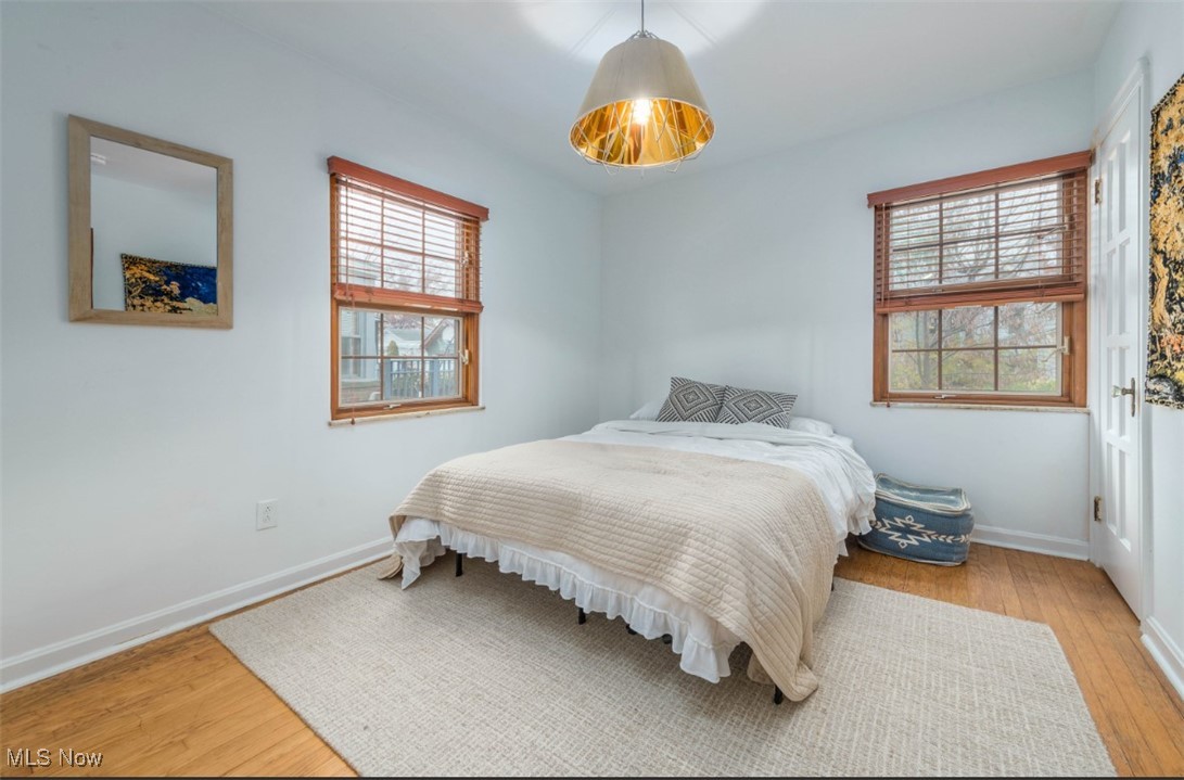 15500 Greenway Road Cleveland, OH 44111 - Photo 20 of 36 Bedroom with light wood-type flooring and baseboards