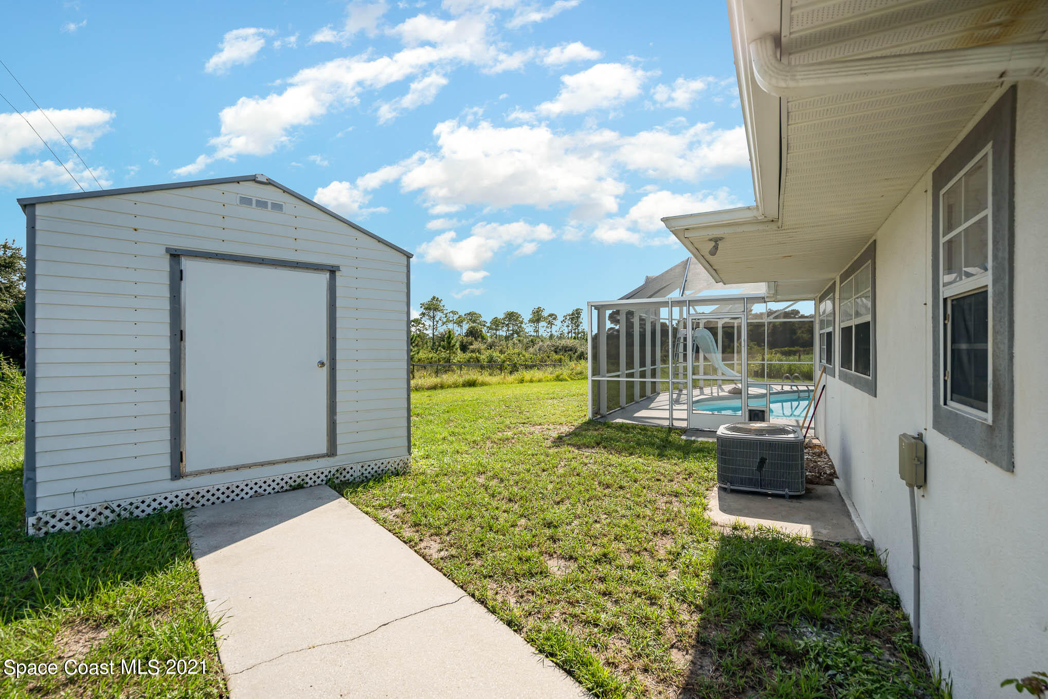 2906 Chipper Drive Northeast Palm Bay, FL 32905 - Photo 3 of 21 Storage Side of Home