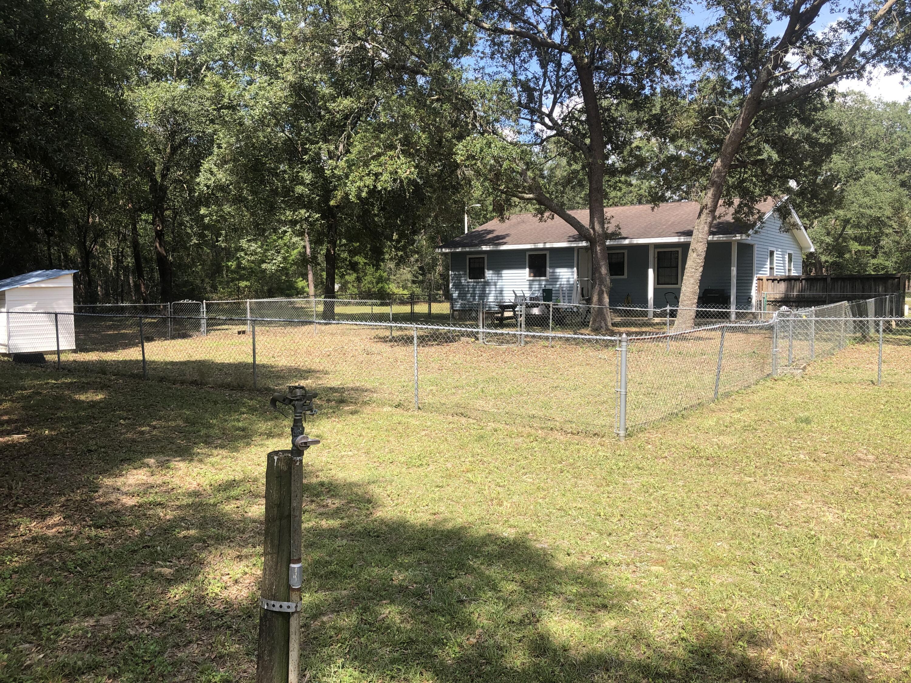 261 Roberts Road DeFuniak Springs, FL 32433 - Photo 4 of 18 a front view of a house with swimming pool yard