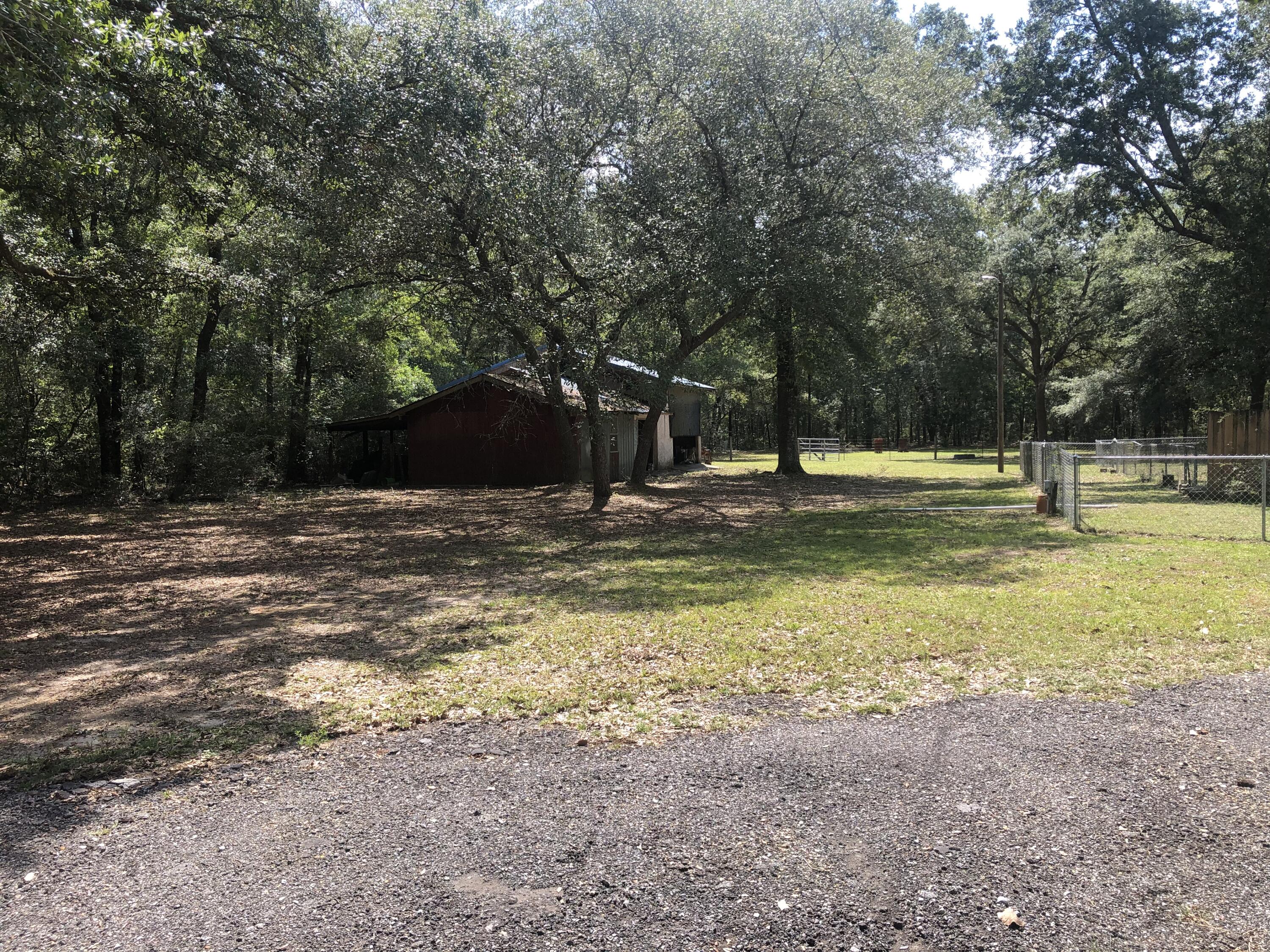 261 Roberts Road DeFuniak Springs, FL 32433 - Photo 5 of 18 a swimming pool with trees in the background