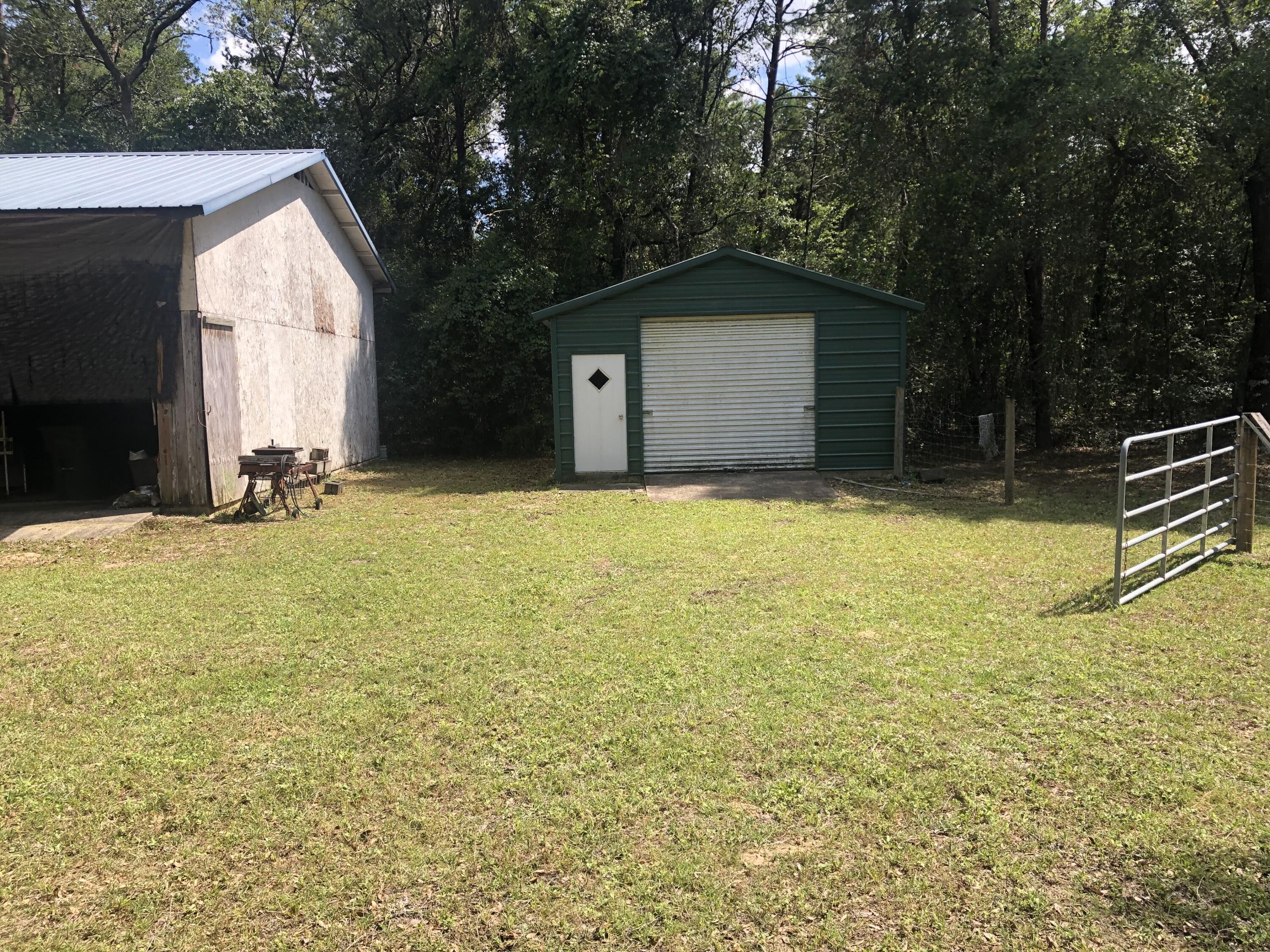 261 Roberts Road DeFuniak Springs, FL 32433 - Photo 7 of 18 a view of a house with a yard