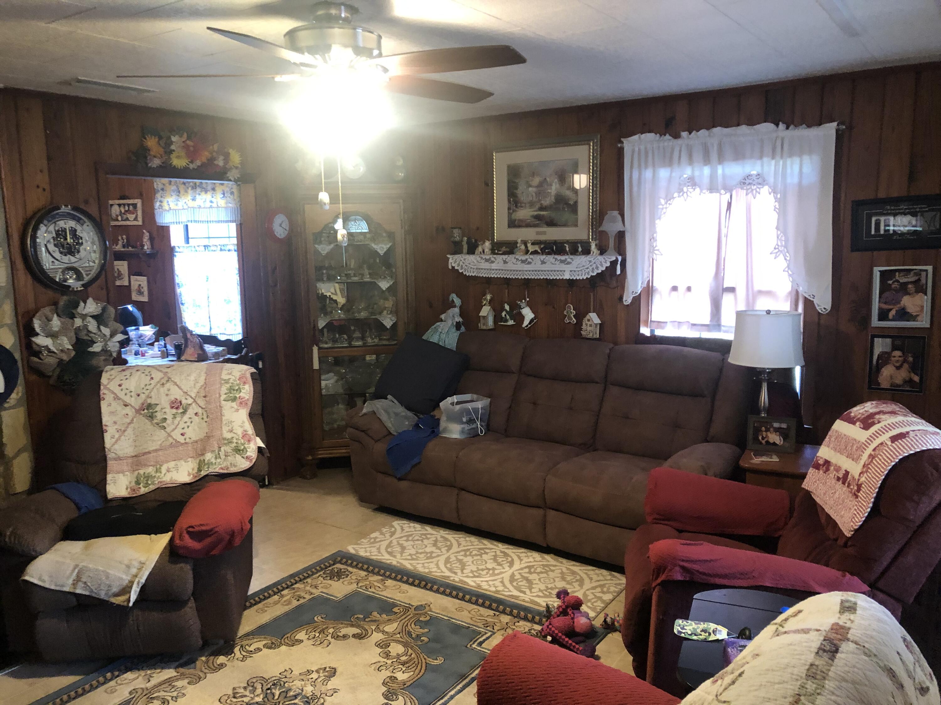 261 Roberts Road DeFuniak Springs, FL 32433 - Photo 9 of 18 a living room with furniture and a window