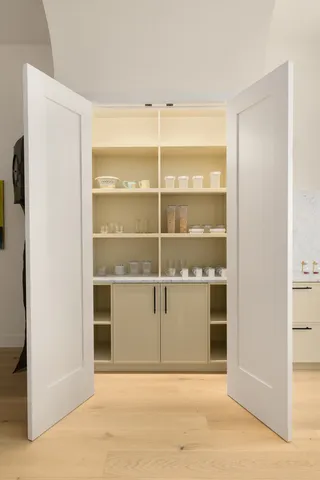 a kitchen with a stove a sink and a refrigerator