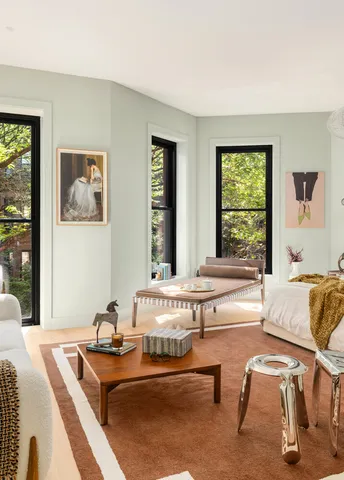 a bathroom with a tub a sink and a window