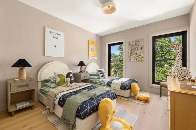 a bedroom with a bed and window