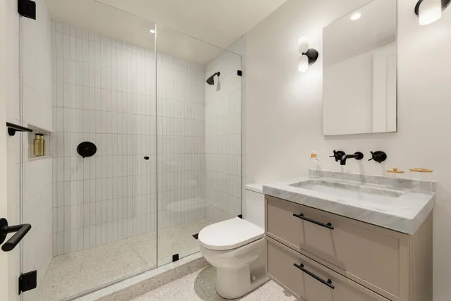 a bedroom with a bed and a table in it