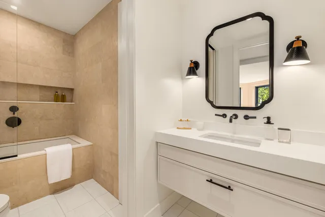 a hallway with a window and a rug