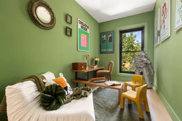 a living room with furniture a rug and a flat screen tv