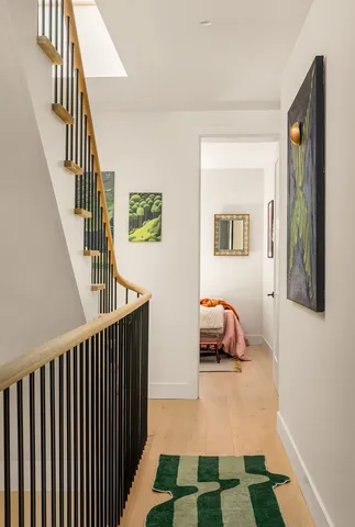 a white toilet sitting next to a shower