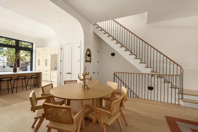 a view of a dining room with furniture and window