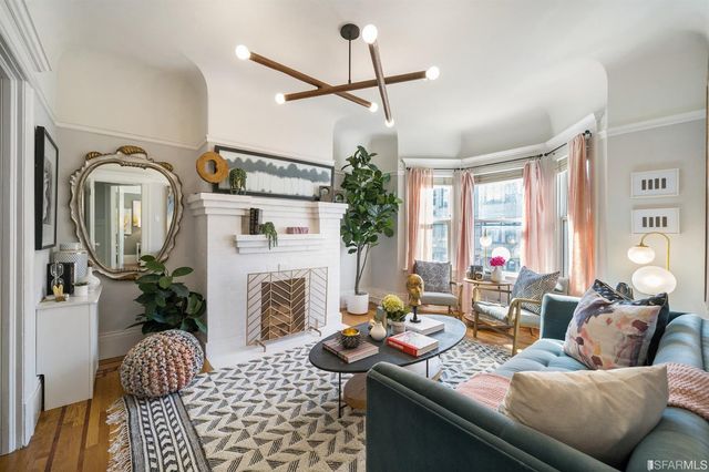 a living room with furniture fireplace and a flat screen tv